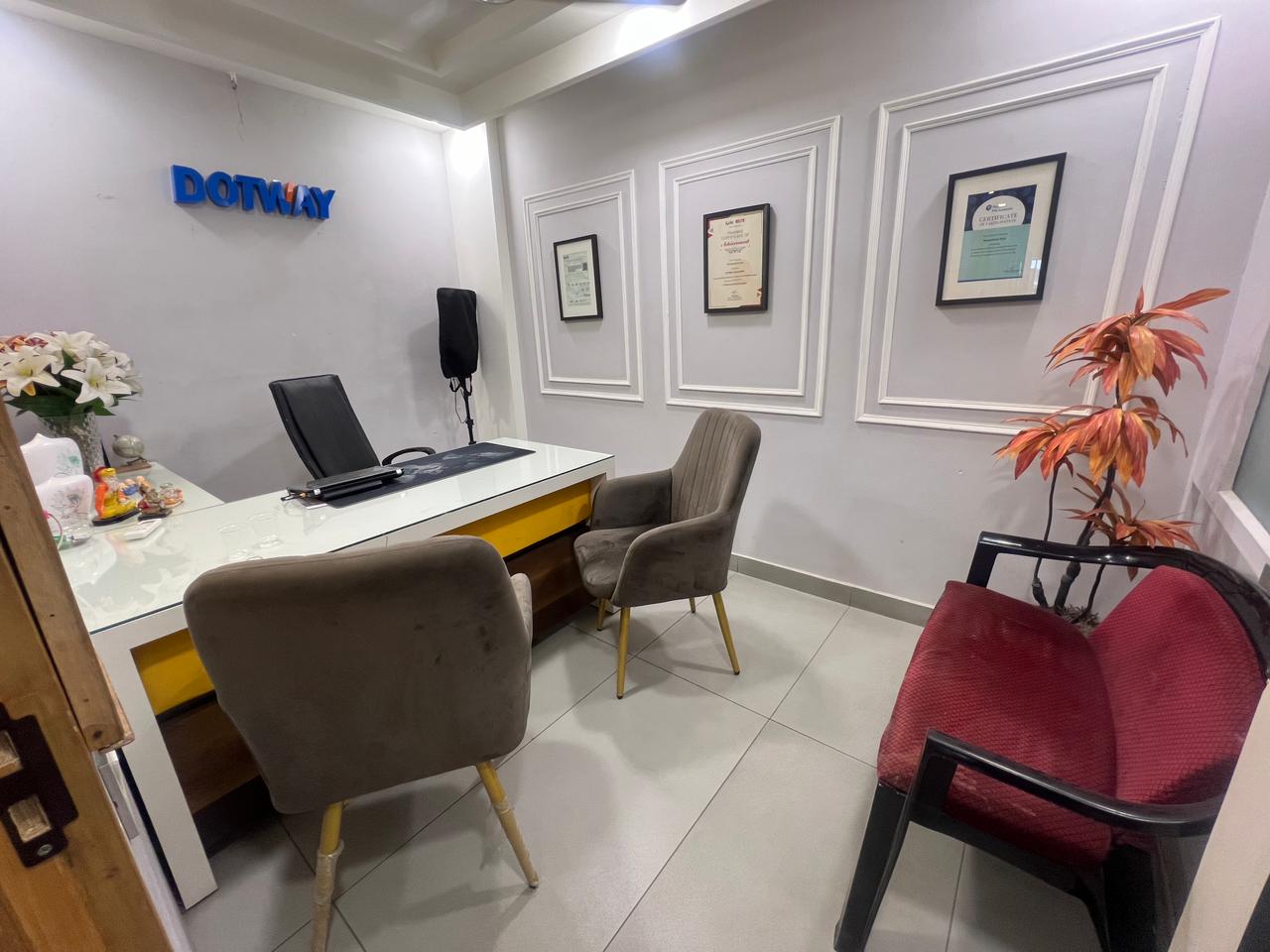 Dotway counselling room with certifications wall